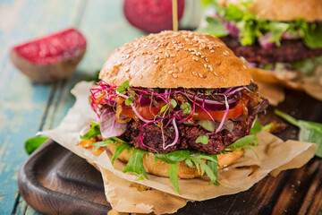 Home made Veggie beet burgers on wooden table, close-up.