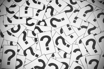 Paper cards with question mark symbols as background