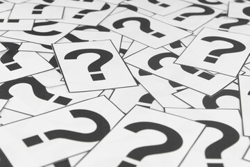 Question marks background. Many paper card with question mark symbols as pattern.