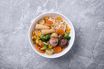 Traditional dish of Asian cuisine: noodles with shiitake mushrooms and vegetables