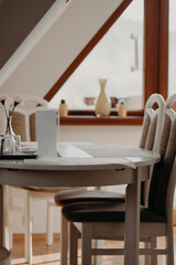 table and chairs in home interior, living room interior in light colors