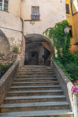 Fototapeta na wymiar Idyllic Archways and cobblestoned streets in Dolcedo, a picturesque village near Imperia, Liguria, Italy