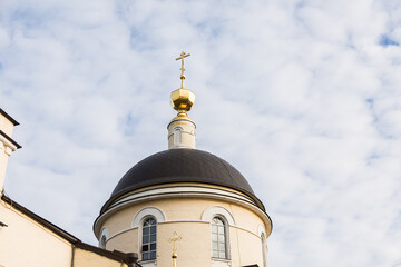 temple building against the sky. Golden dome of the church
