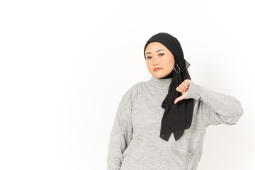 Showing Thumbs Down of Beautiful Asian Woman Wearing Hijab Isolated On White Background