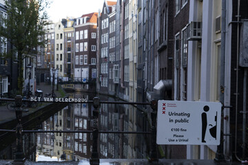 do not pee no urinating in the street sign in Amsterdam canal