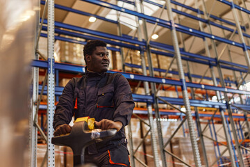 Fototapeta premium Busy factory worker, staring his next task