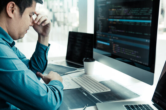 Software developers headache with code analysis in the office.