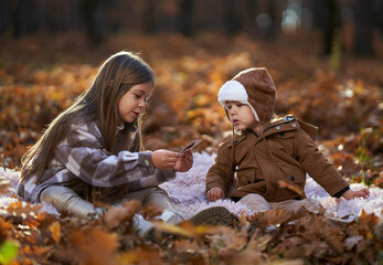 Brothers playing cards in the forest, autumn time