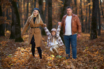 Fototapeta premium Family and girl in the forest