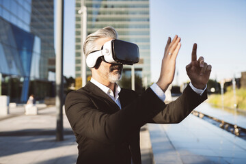 Businessman gesturing wearing virtual reality headset