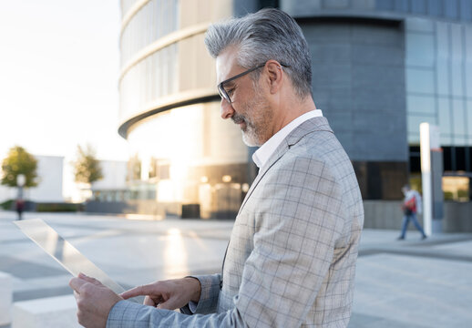 Businessman using portable glass device