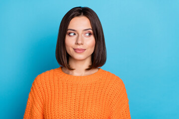 Portrait of attractive girlish cheerful girl looking aside overthinking isolated over bright blue color background