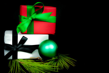 Gifts wrapped with colorful paper on black background