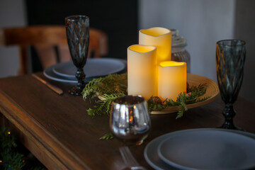 Fototapeta na wymiar Christmas wooden festive table with burning candles
