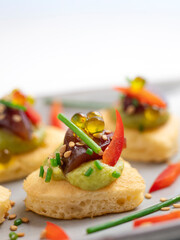 Tuna blinis with avocado. Traditional canape for Christmas.