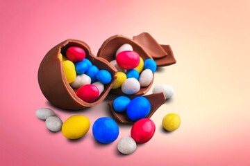 Pile of delicious colorful, tasty candies of different shapes on a background.