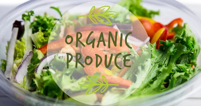 Animation of organic produce text in green, over bowl of fresh salad