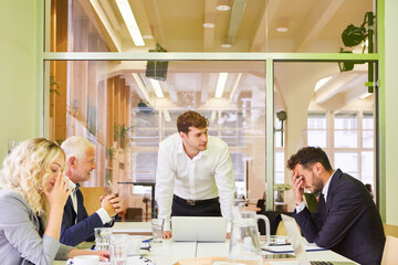 Entrepreneur in meeting with his start-up team