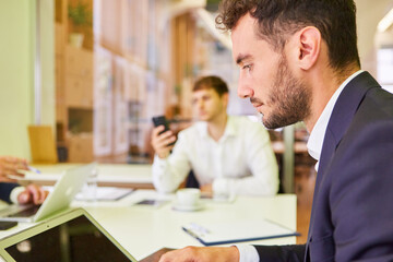 Young business man is working concentrated on the computer