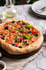 Freshly baked pizza on a wooden board