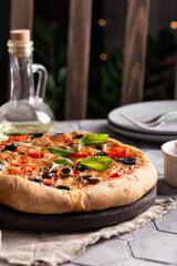 Freshly baked pizza on a wooden board