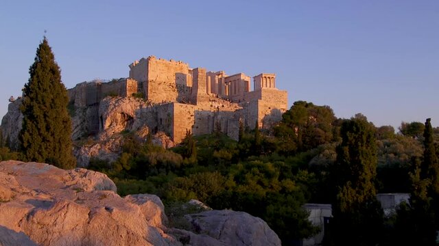 The Parthenon's on the Acropolis dominates the city skyline of Athens, Greece.
