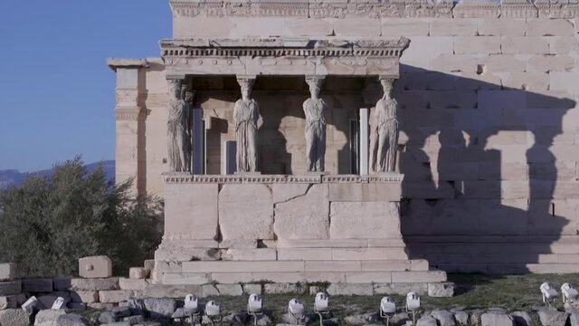 Female figures holding a building's structure at the Acropolis, Athens, Greece.