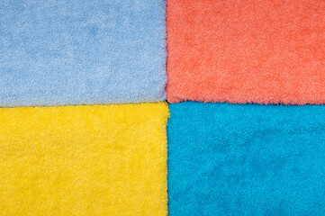 Composition of colored cotton towels. The concept of softness and purity