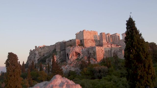 Man taking photos of the Parthenon during sunset, Athens, Greece.