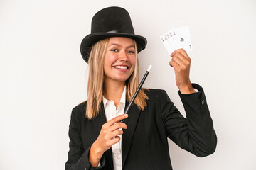 Young caucasian wizard woman holding wand and magic cards isolated on white background