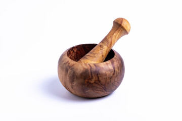 isolate, wooden mortar with pestle on white background, close-up