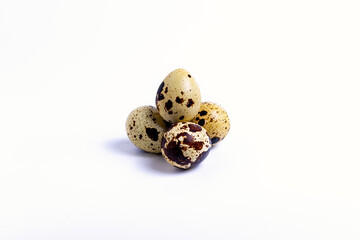 isolate, a bunch of quail eggs on a white background, close-up