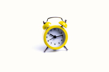 isolate, yellow alarm clock on white background, close-up