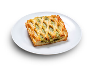 Empanada de verduras y piñones sobre fondo blanco. Vegetable pie and pine nuts on white background.