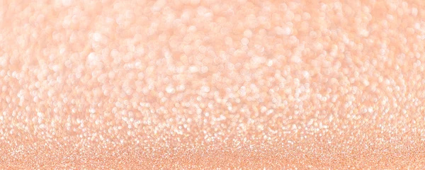 Abstract blurred coral or peach magic glitter banner with copy space.