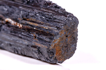 macro mineral stone sherle, schorl, black tourmaline on white background