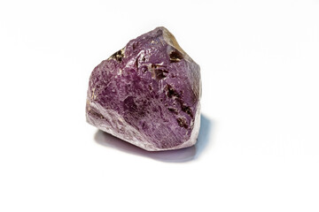 Macro of Alexandrite mineral stone in rock on white background