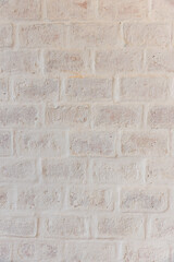 White brick wall background in rural room. Abstract weathered texture stained old stucco light gray. White grunge brick wall background. Misty brick wall for background or texture.