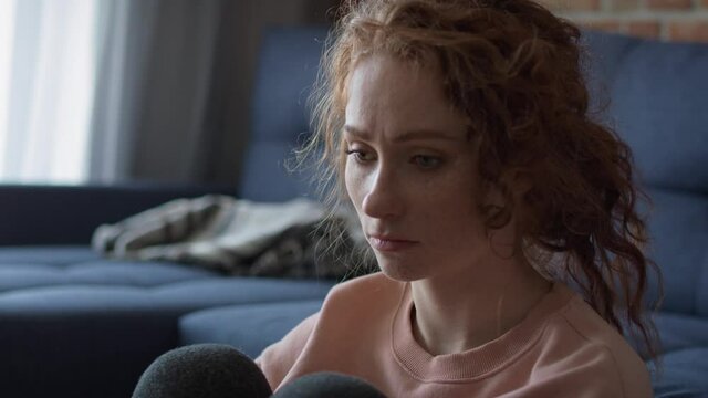 Thoughtful young caucasian woman at home. Shot with RED helium camera in 8K.