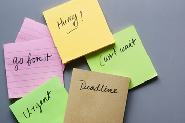 close up of deadline word on a stick note paper .