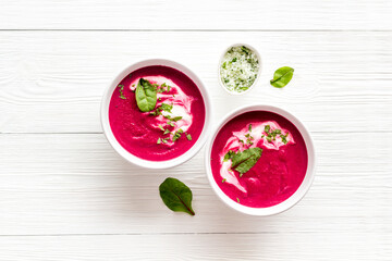 Red vegetarian beet root soup with sour cream