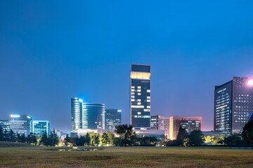 Fototapeta na wymiar Night view of office buildings in Suzhou Financial District, China