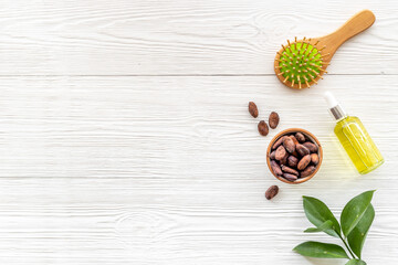 Hair treatment by cocoa oil with hair comb. Top view