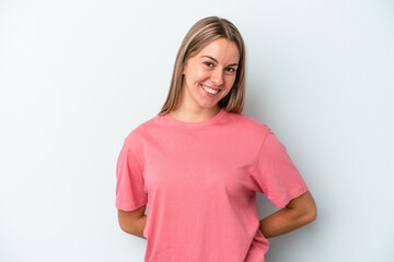 Fototapeta premium Young caucasian woman isolated on blue background happy, smiling and cheerful.