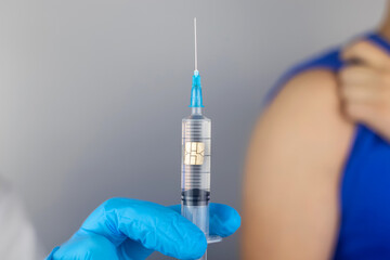 Concept. Chipping through vaccinations. Government conspiracy. Vaccination and implantation of a...
