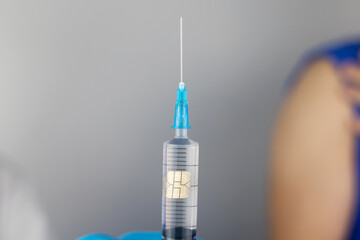 Concept. Chipping through vaccinations. Government conspiracy. Vaccination and implantation of a...