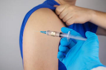 Concept. Chipping through vaccinations. Government conspiracy. Vaccination and implantation of a tracking microchip into the human body. Implantation of electronic technologies into the human body