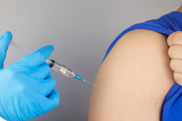 Concept. Chipping through vaccinations. Government conspiracy. Vaccination and implantation of a tracking microchip into the human body. Implantation of electronic technologies into the human body