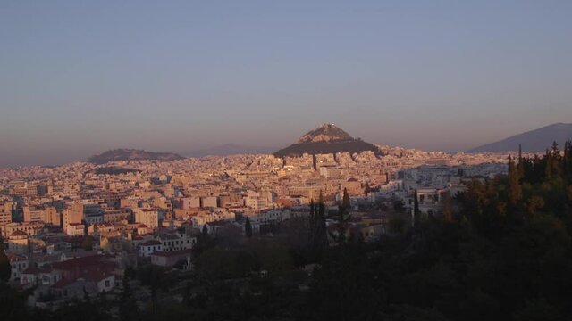 The sun sets over Athens, Greece.