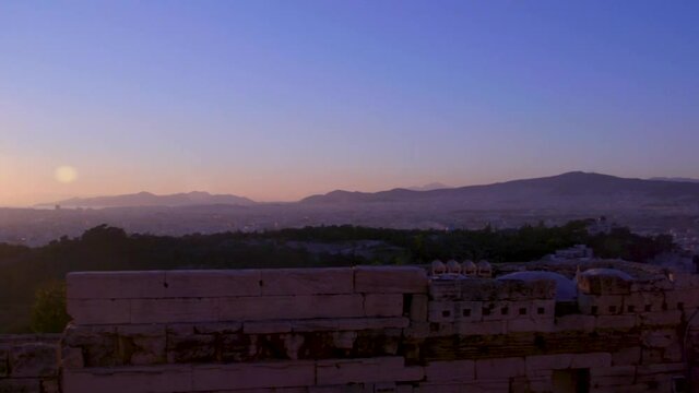 The sun sets over Athens, Greece.